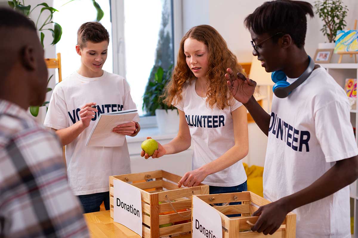 teenagers helping with donations